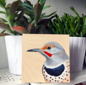 A print of a Northern Flicker with some plants by Maggie Hurley