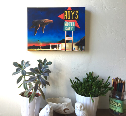 A Humpback whale painting by Maggie Hurley mounted on wood on a wall