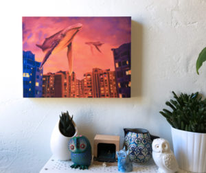 Print on wood of a painting by Maggie Hurley of two humpback whales in the sky over the Ukraine