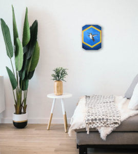 Oil painting of bird art. Calliope hummingbird in flight. Pictured in a room