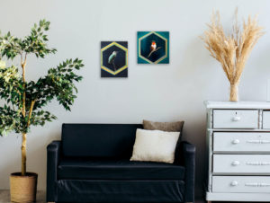 two paintings of hummingbirds on wall