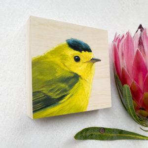Painted portrait of a wilson's warbler on a wood panel by bird artist Maggie Hurley