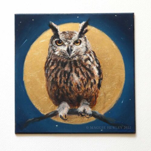 Eurasian eagle-owl with a moon and night sky